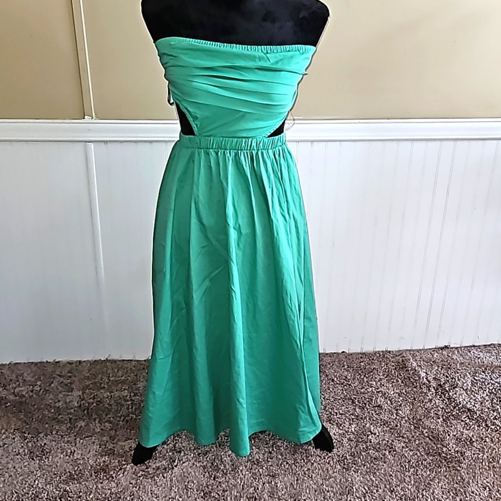 Green tube dress, with open sides, knee length. New with tags